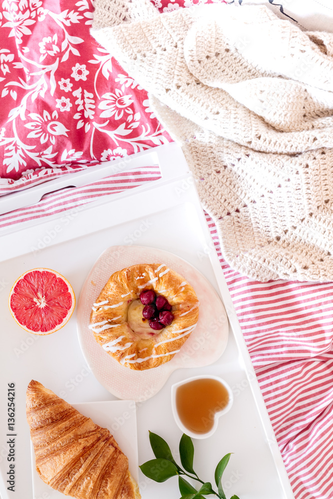 concept of breakfast in bed on tray with juice