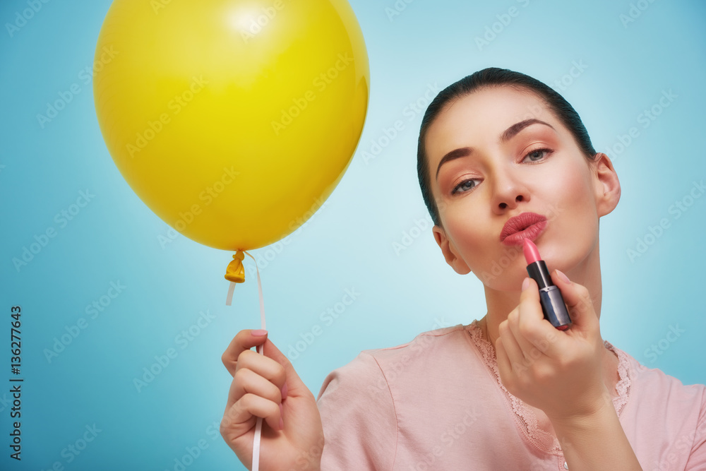 woman on background of bright blue wall