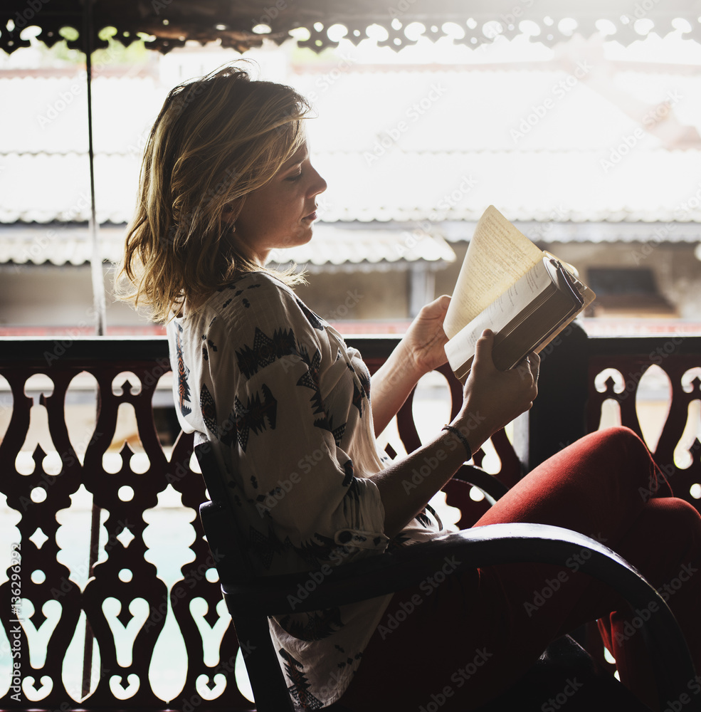 Young Woman Reading Book Concept