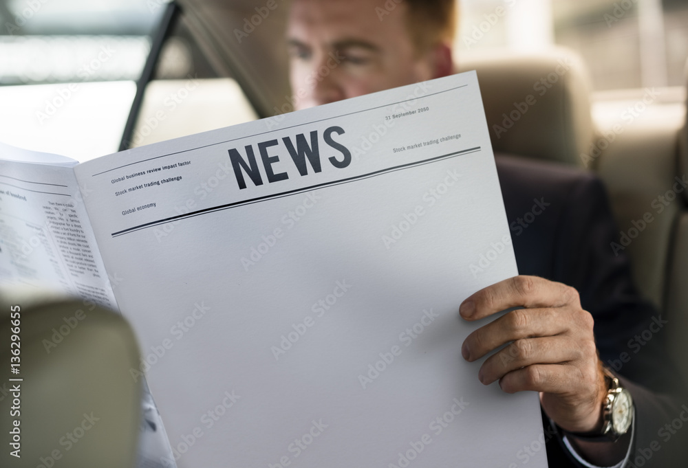 Businessman Reading Newspaper Car Inside