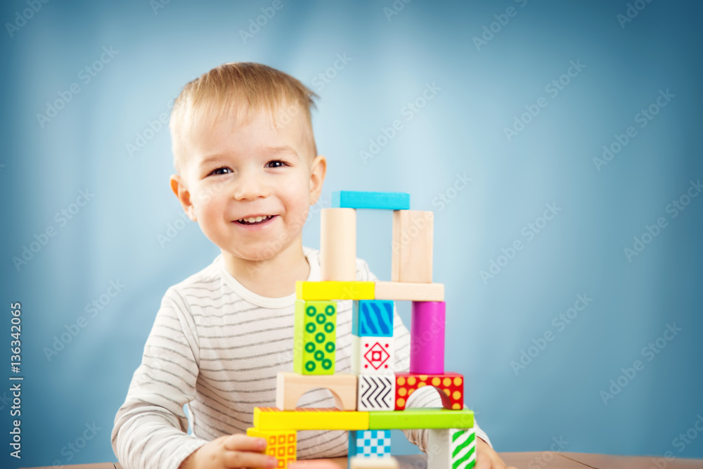 Portrait of a two years old child sitting at the table