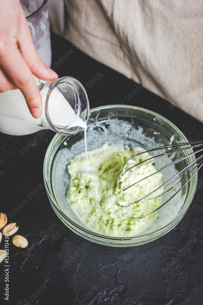 organic ice cream homemade process on dark background with hands