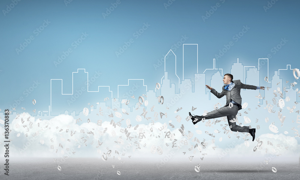 Businessman jumping high