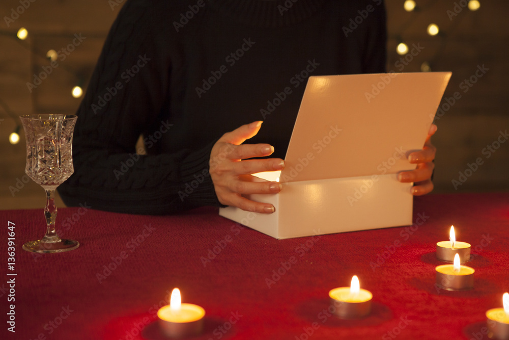 The woman is surrounded by a candle and received a gift