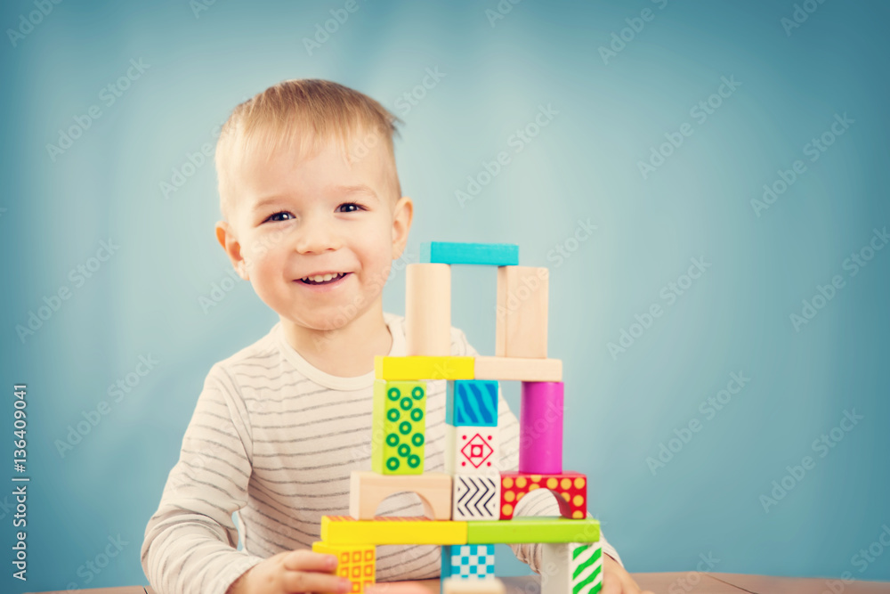 Portrait of a two years old child sitting at the table