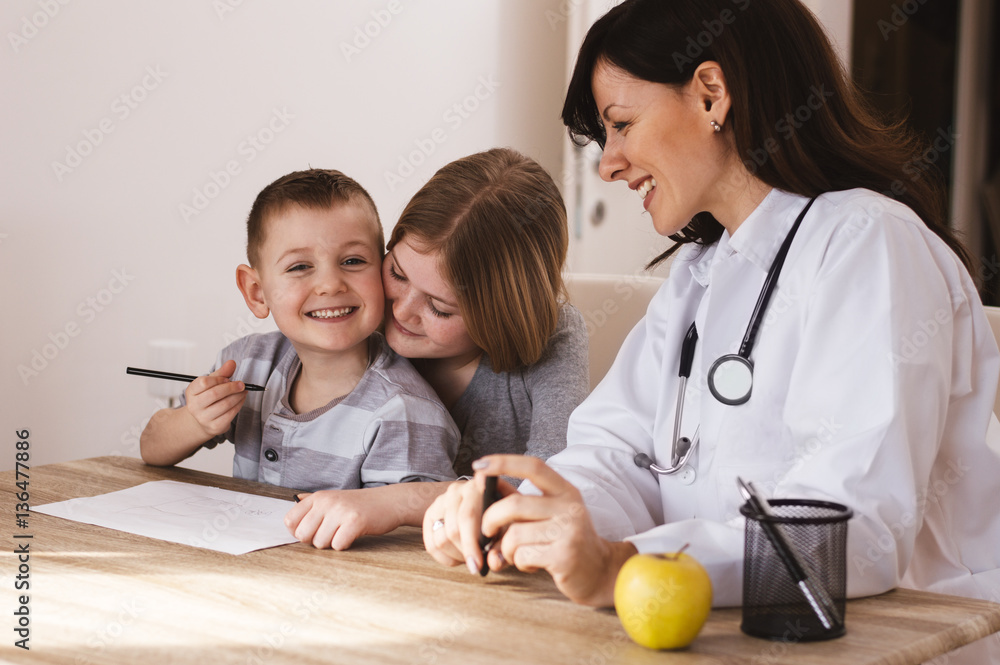 Female doctor is having fun with kids at her office