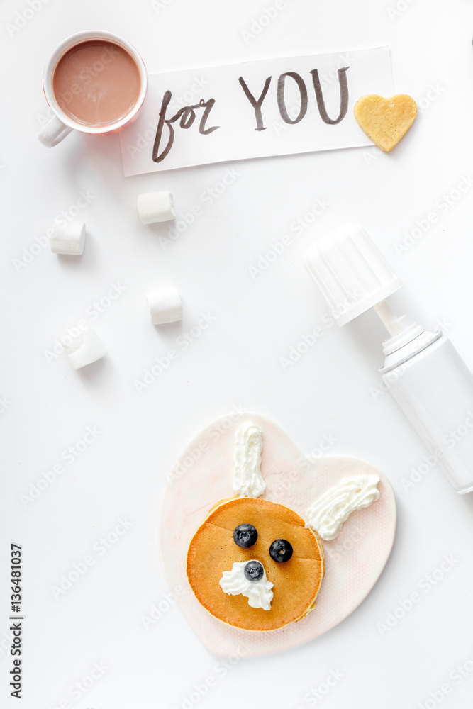 concept kid breakfast with pancake top view on white background