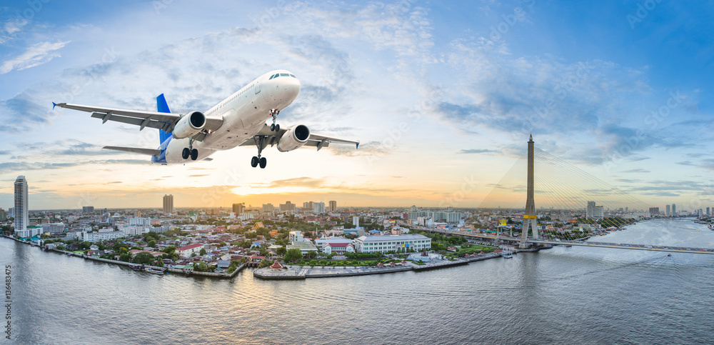 Airplane take off over the panorama city at twilight scene