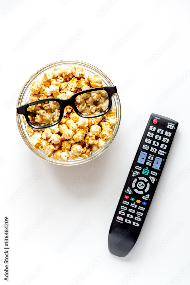 concept of watching movies with popcorn top view white background