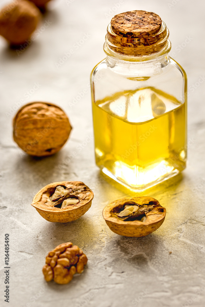 cosmetic and therapeutic walnut oil on gray background