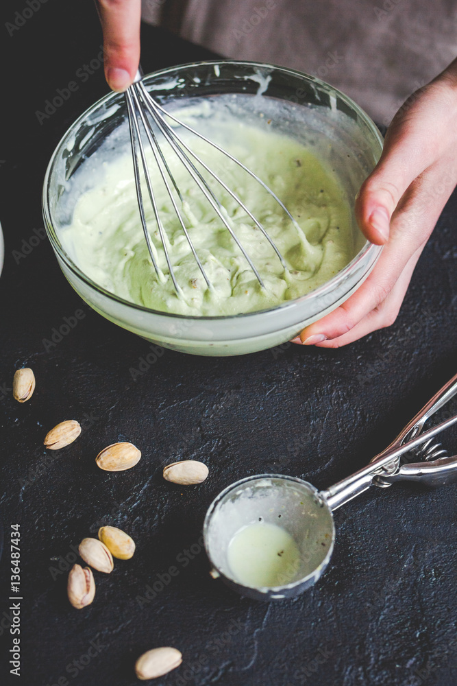 organic ice cream homemade process on dark background with hands