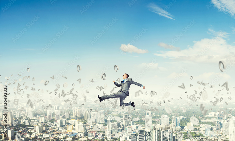 Businessman jumping high