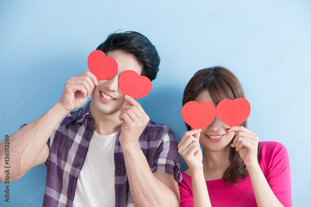 Happy couple holding love heart