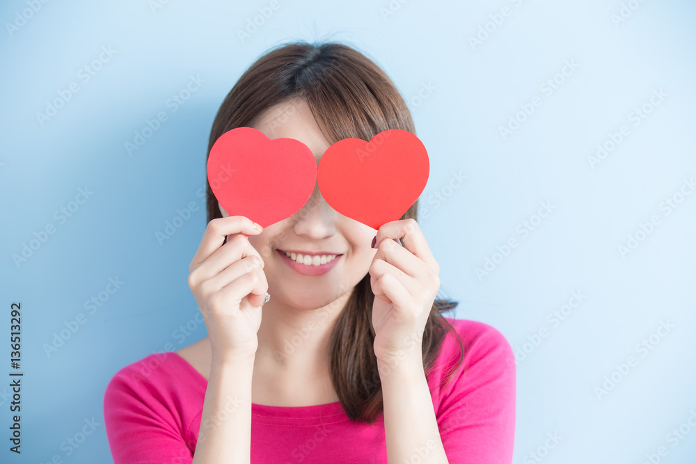 woman holding red love hearts