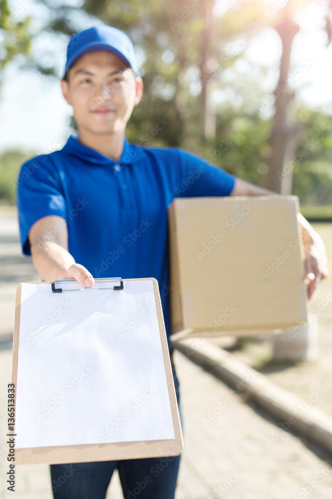 deliveryman take cardboard