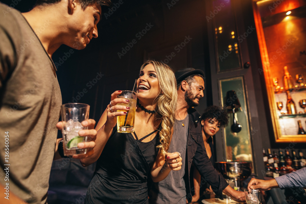 Group of people having fun at nightclub