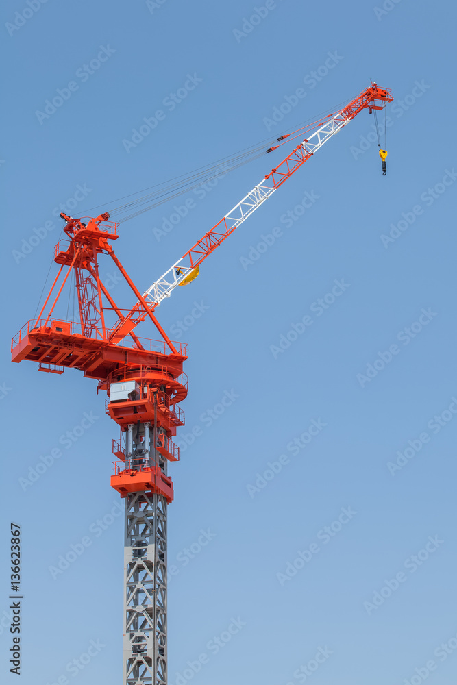 Close - up big red crane at construction site