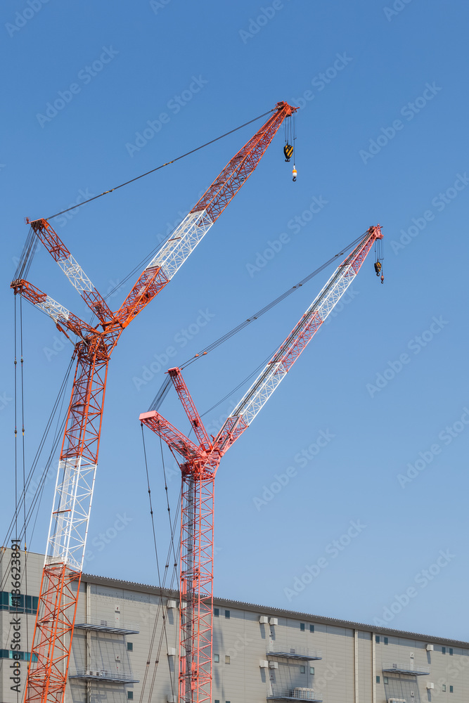 Close - up big red crane at construction site