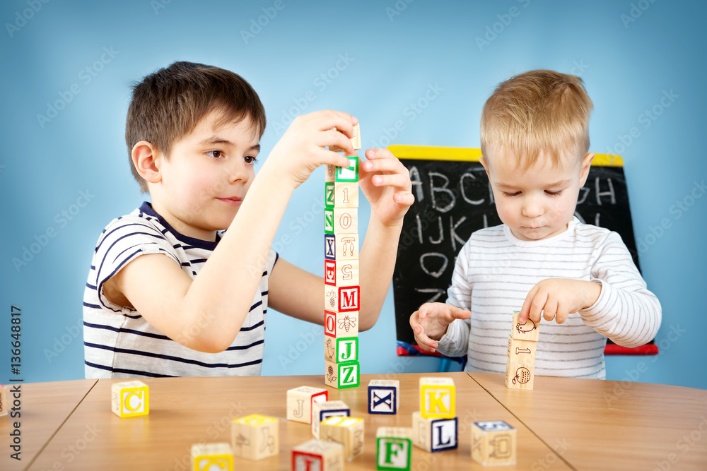 Children playing with cubes on the table