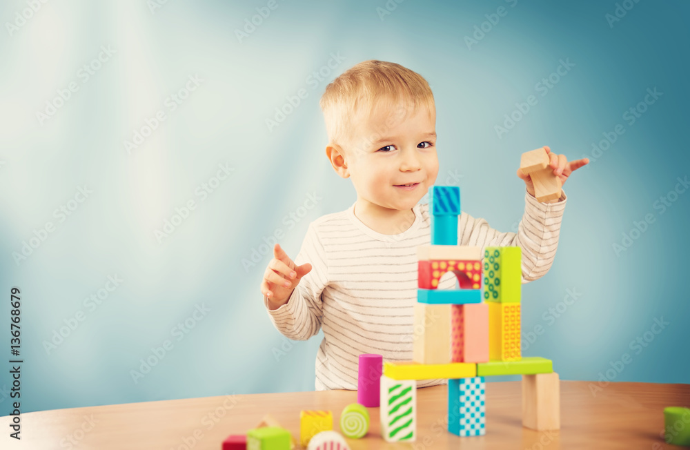 Portrait of a two years old child sitting at the table