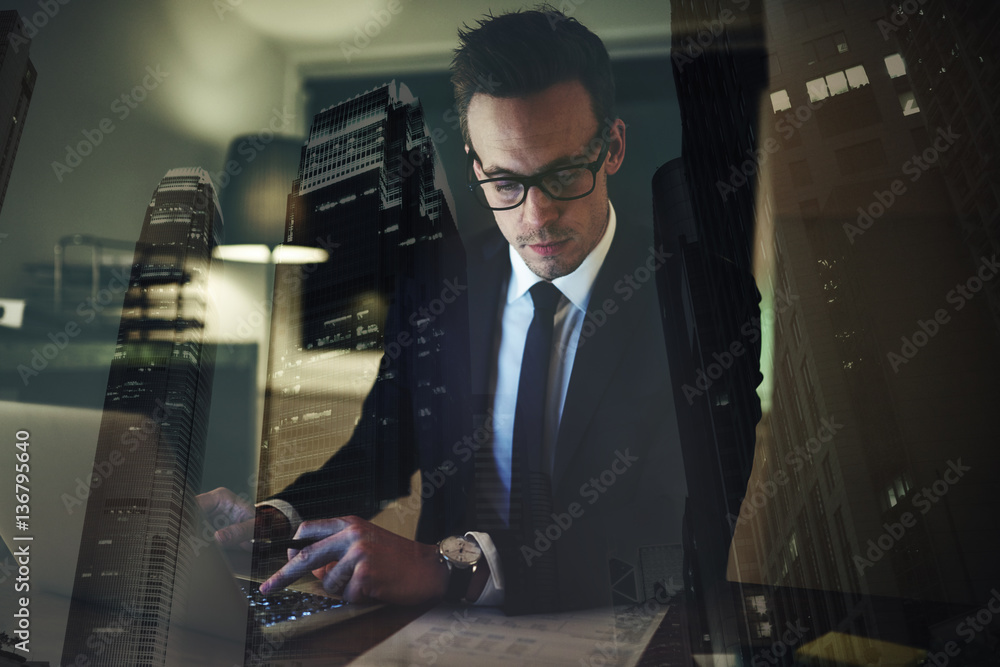 Businessman in suit working overtime