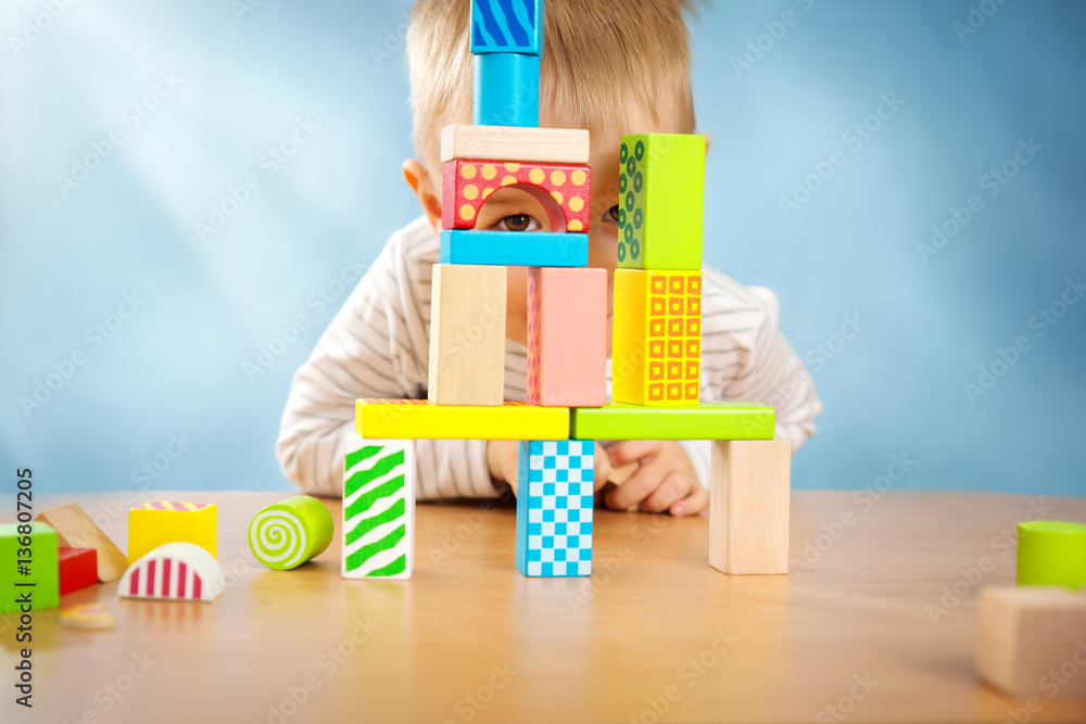 Portrait of a two years old child sitting at the table