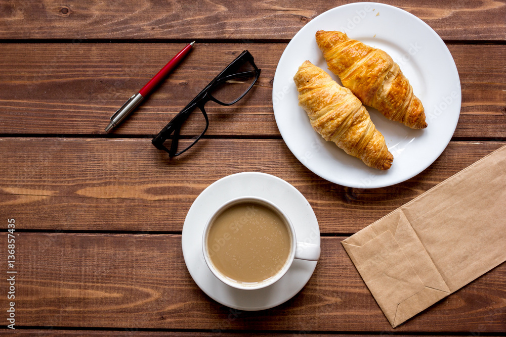 Business breakfast with coffee and croussant top view