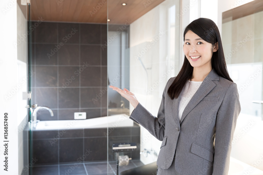 asian businesswoman showing bathroom