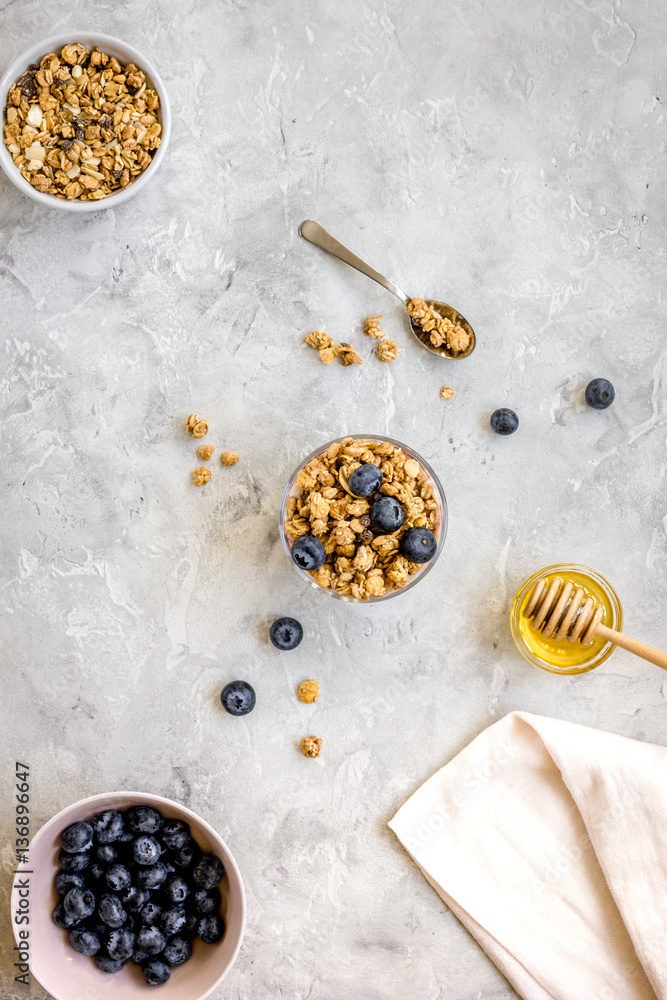 Oat flakes with honey and berries on table background top view