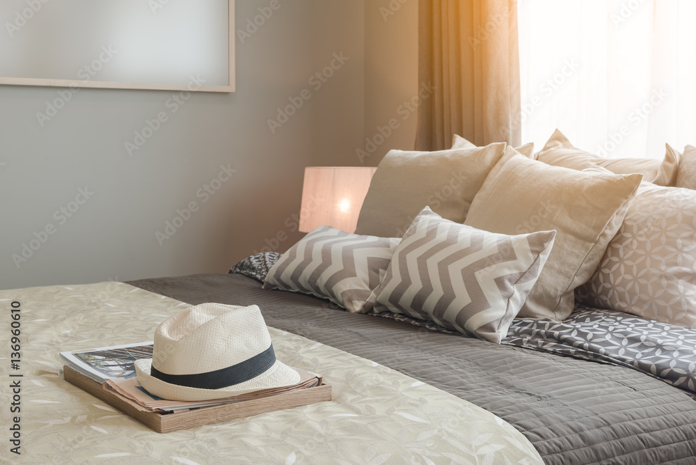 set of pillows on bed in cozy bedroom