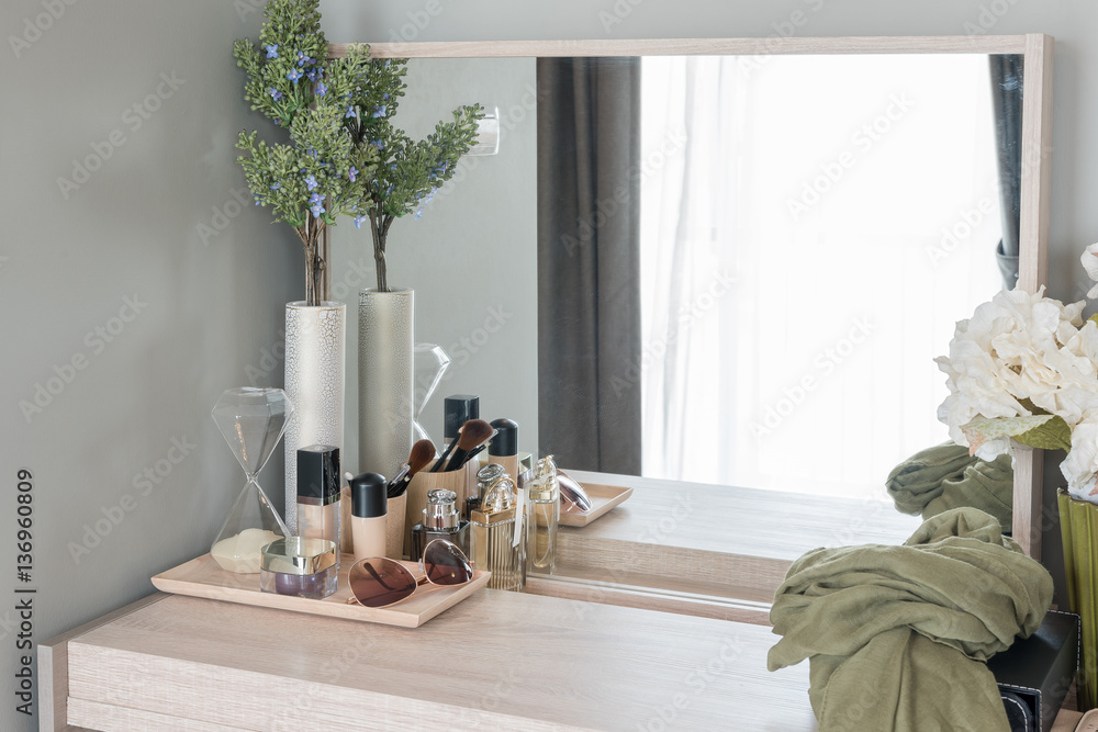 Beauty and make-up concept: table mirror, flowers, perfume, jewe