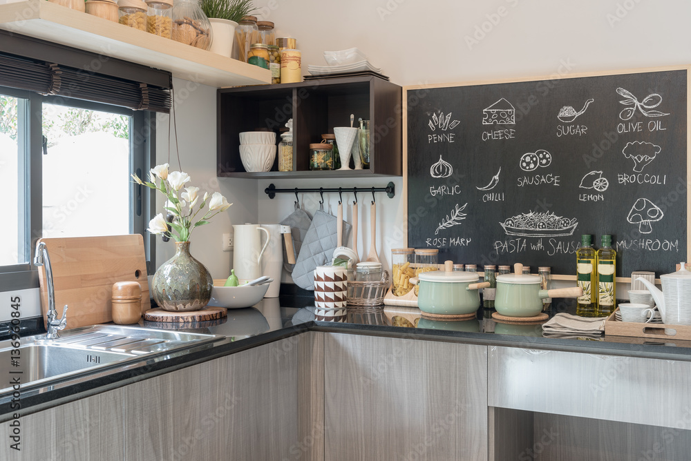 modern kitchen room with black granite on top of counter