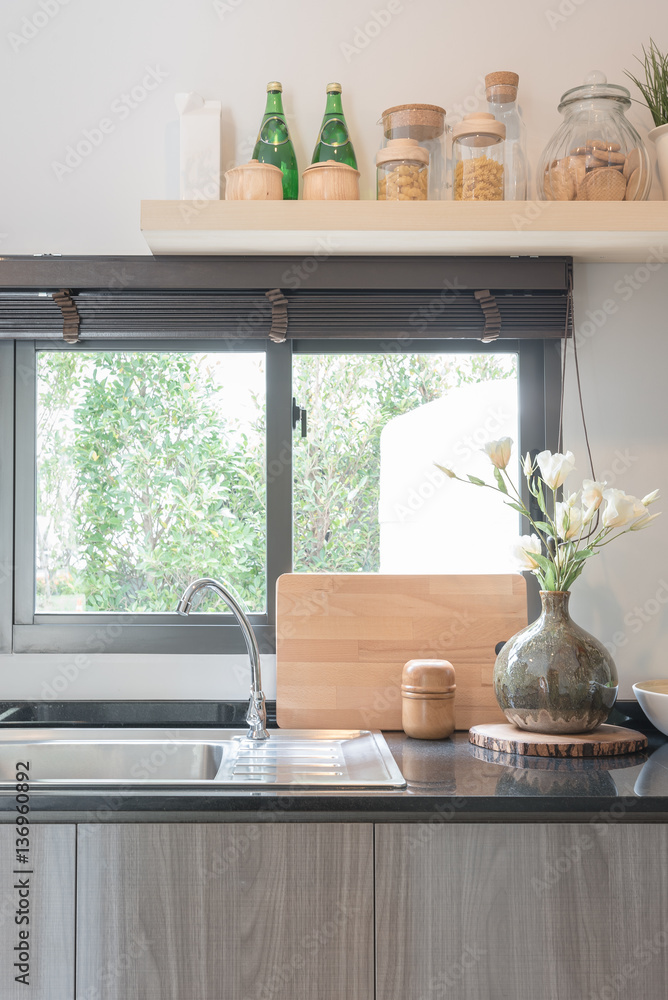 modern kitchen room with black granite on top of counter