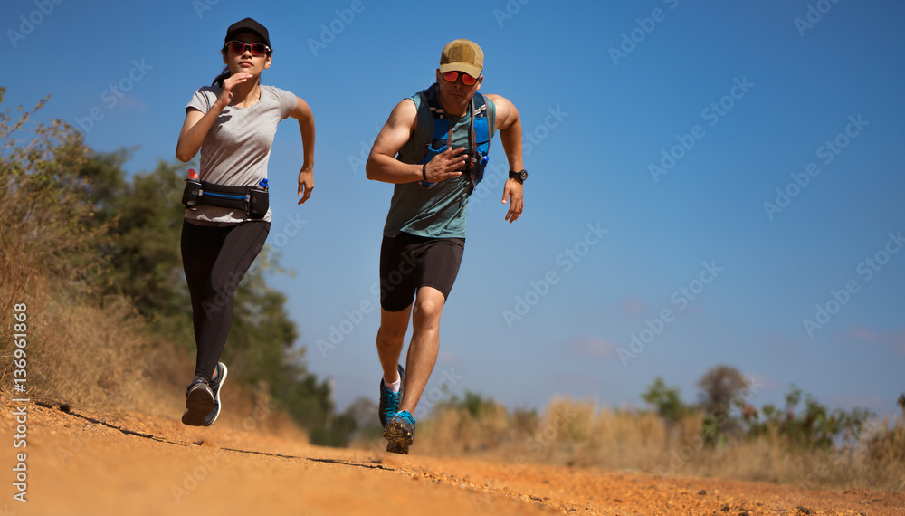 Couple Runner of Trail. He was running fast