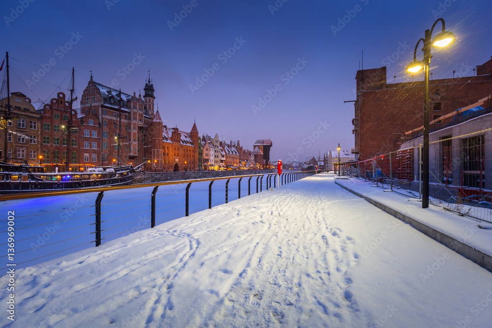 Old town of Gdansk at Motlawa river in snowy winter, Poland