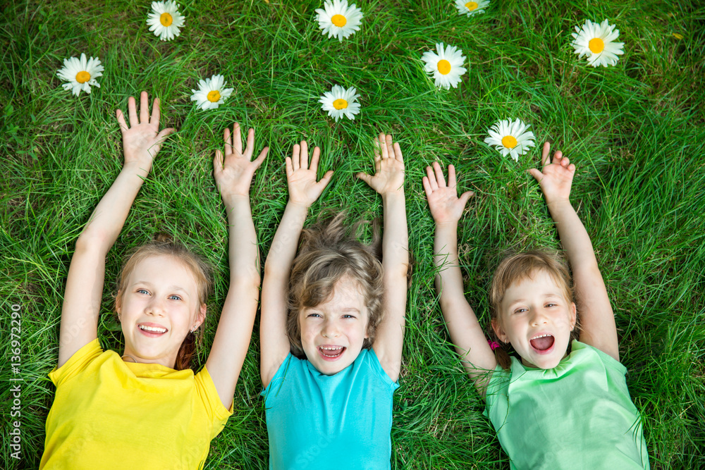 Group of happy children playing outdoors