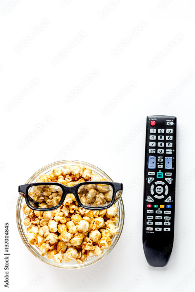 concept of watching movies with popcorn top view white background