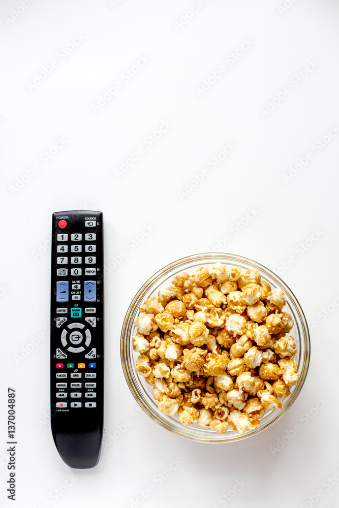 concept of watching movies with popcorn top view white background