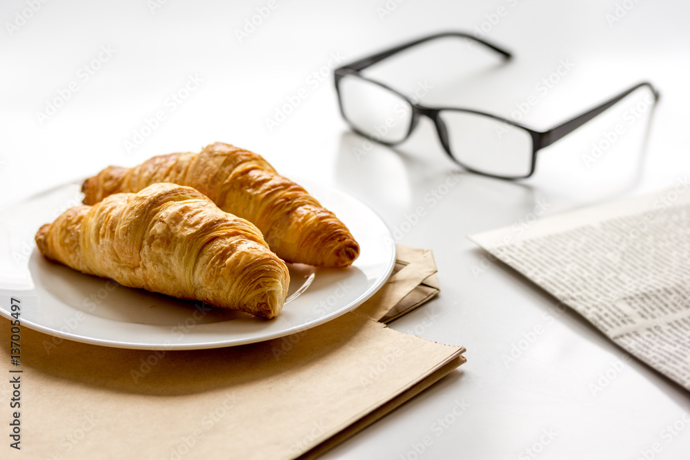 Business lunch with croissant on white table top view