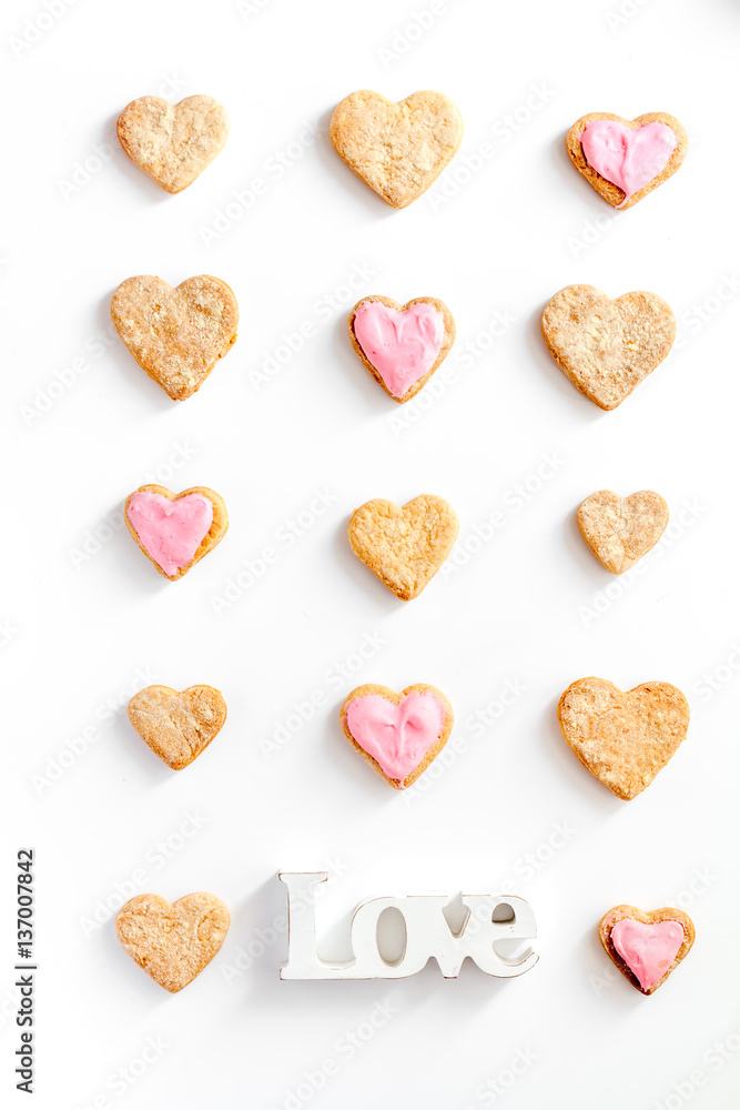 cookies for Valentine Day heartshaped white background top view pattern