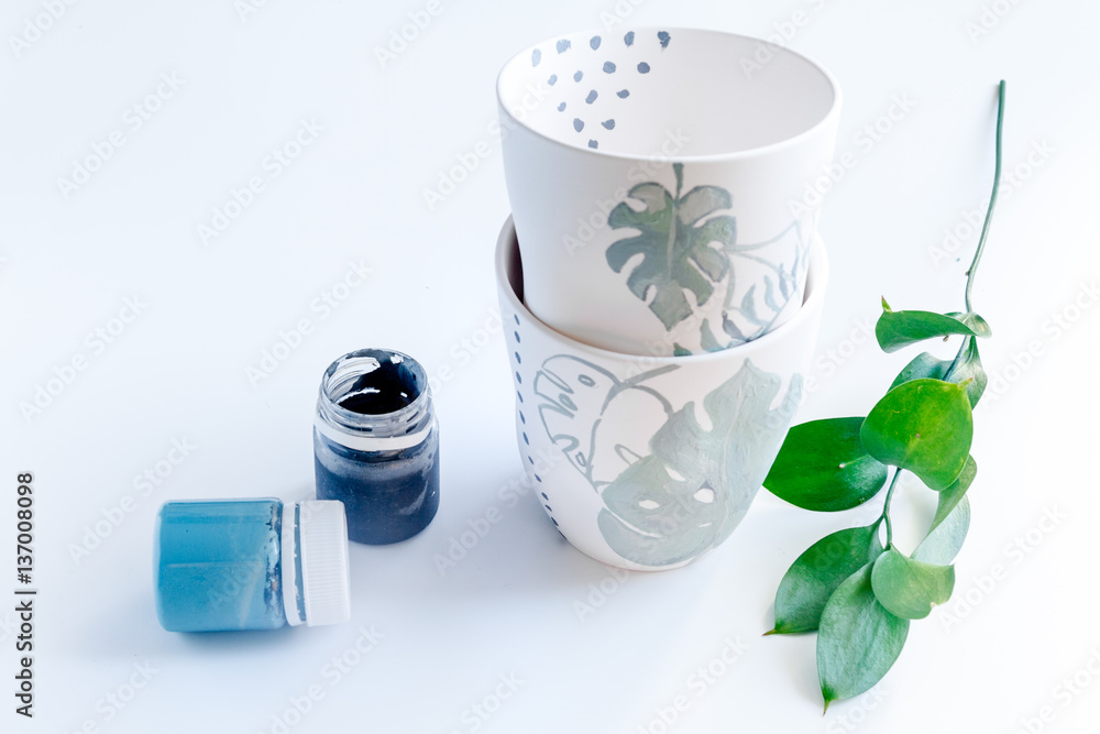 painted ceramic cup on white background