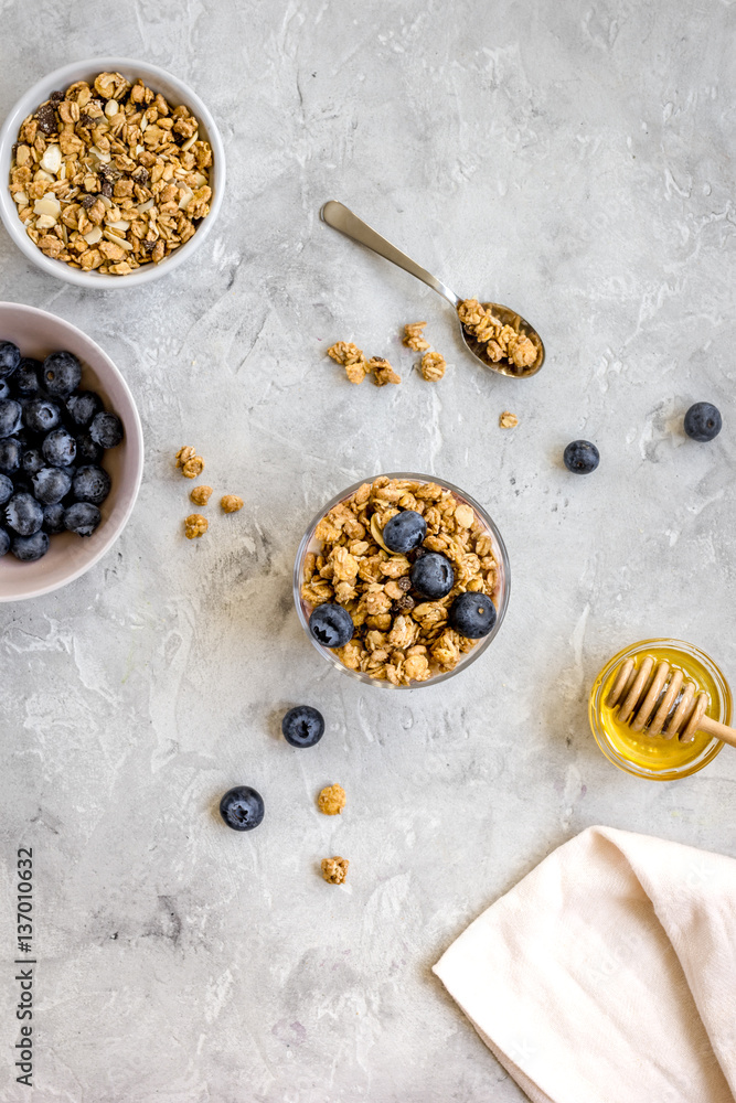 Healthy morning with yogurt, muesli and berries table ground top view