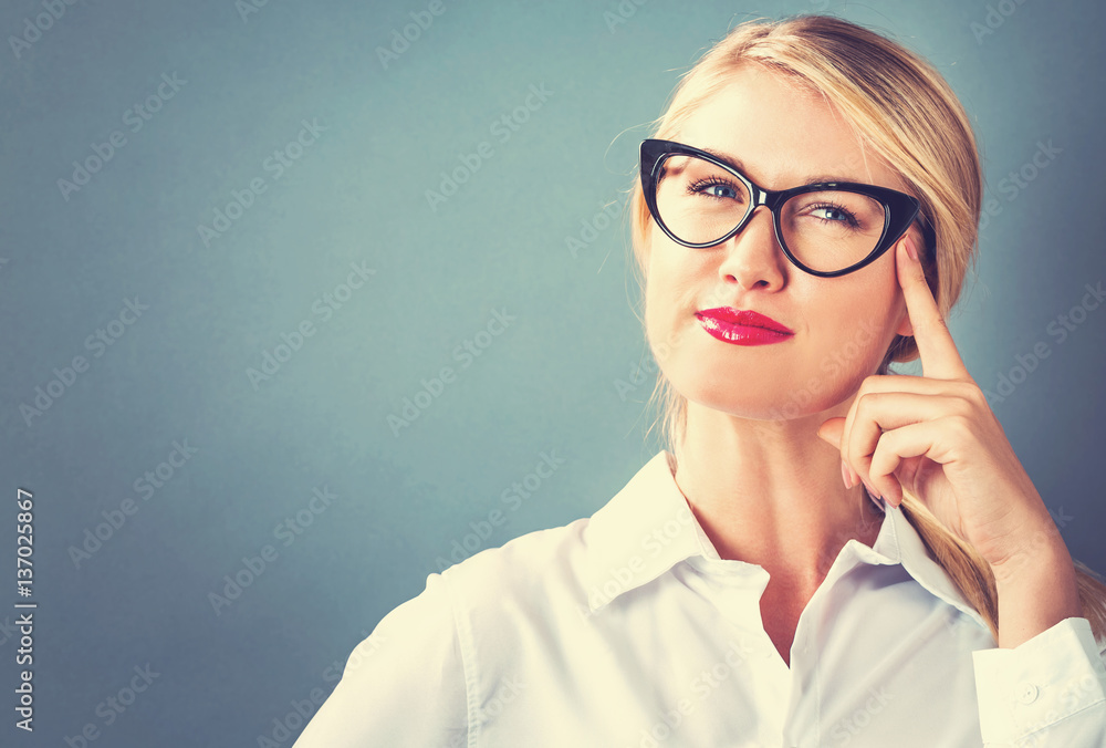 Young woman in a thoughtful pose