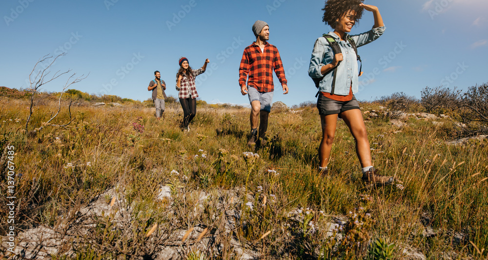 Young friends hiking in countryside