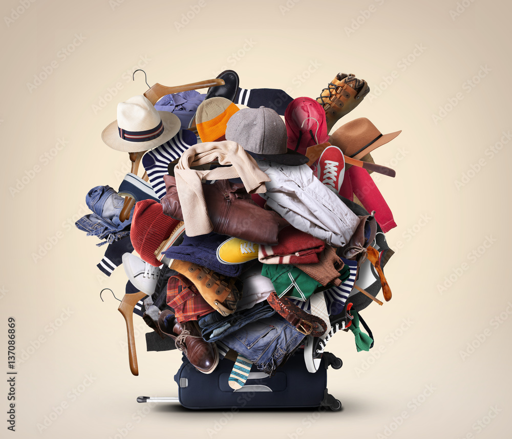 Big heap of different clothes and shoes