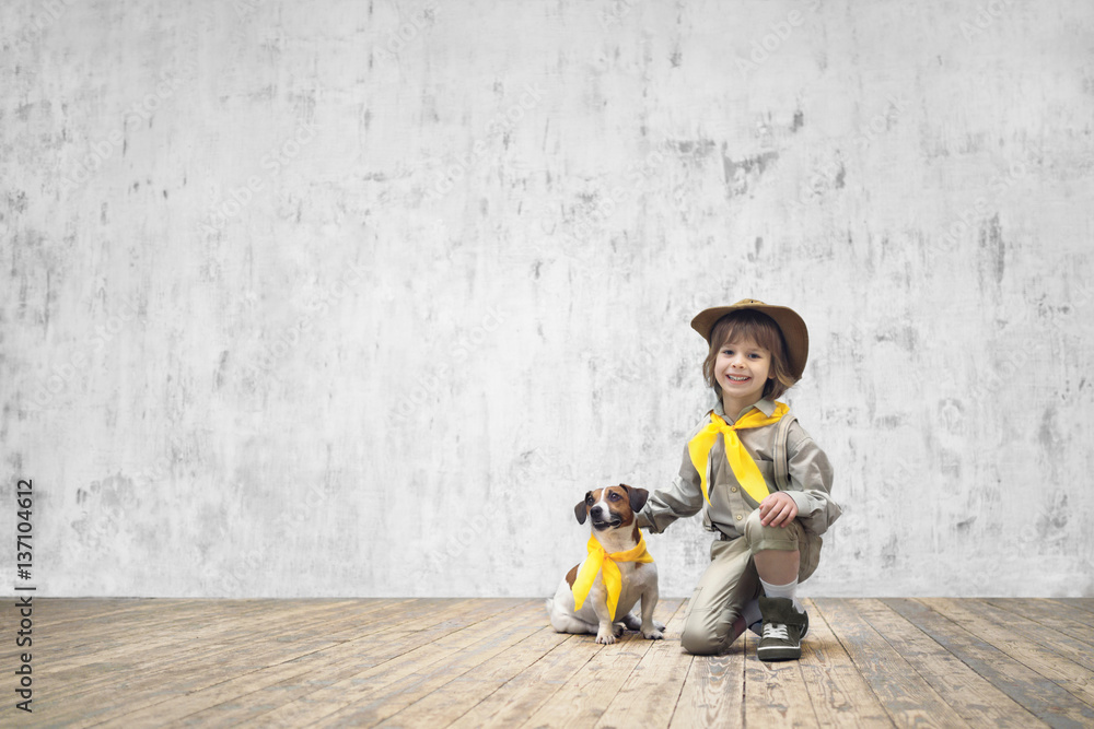 Boy in uniform with dog