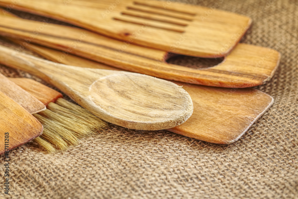 Various kitchen utensils on a rustic background.