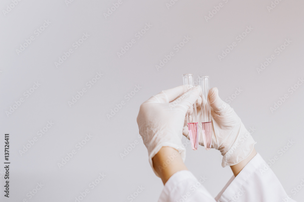 Professional young scientist is analyzing a sample