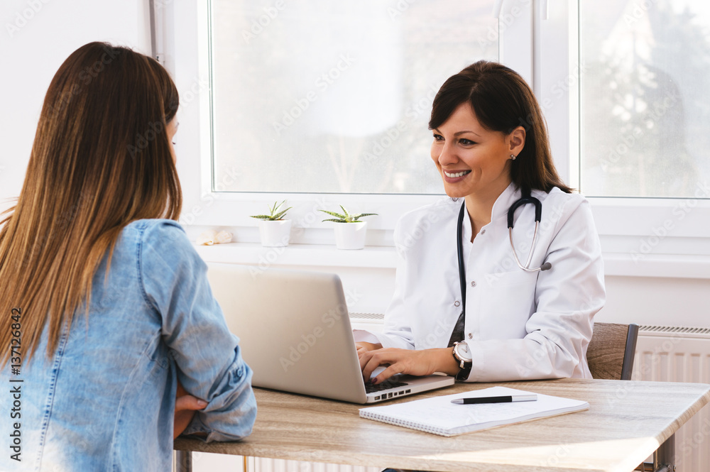 Female doctor discussing report with patient