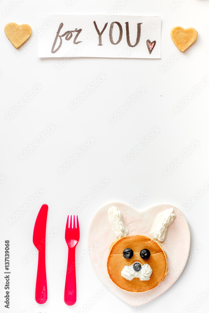 concept kid breakfast with pancake top view on white background